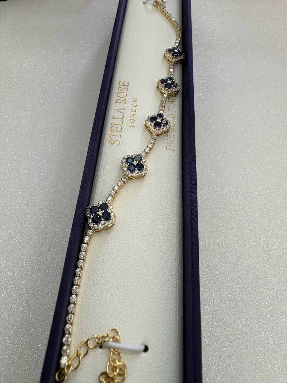 Gold Bracelet with Navy Blue Floral Accents